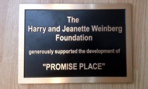A plaque for the harry and jennette weberg foundation.