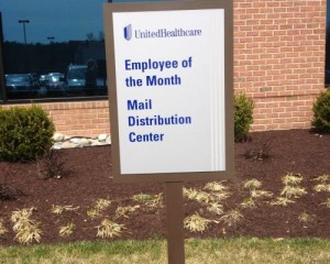 A sign that says employee of the month mail distribution center.