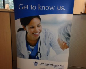 A roll up banner with a picture of a doctor and a nurse.