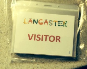 Lancaster visitor badge in a plastic bag.