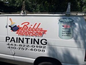 Side panel of a white commercial van showcasing 