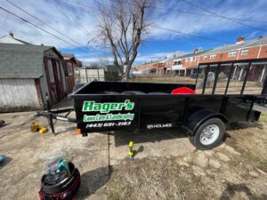 A black lawn care trailer with 