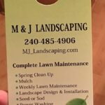 Door hanger for m & j landscaping advertising services like lawn maintenance and fence installation, with contact information, a leaf graphic, and text stating 